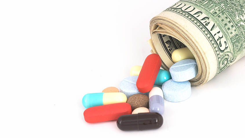 a roll of bills from which spill out pills of many colors